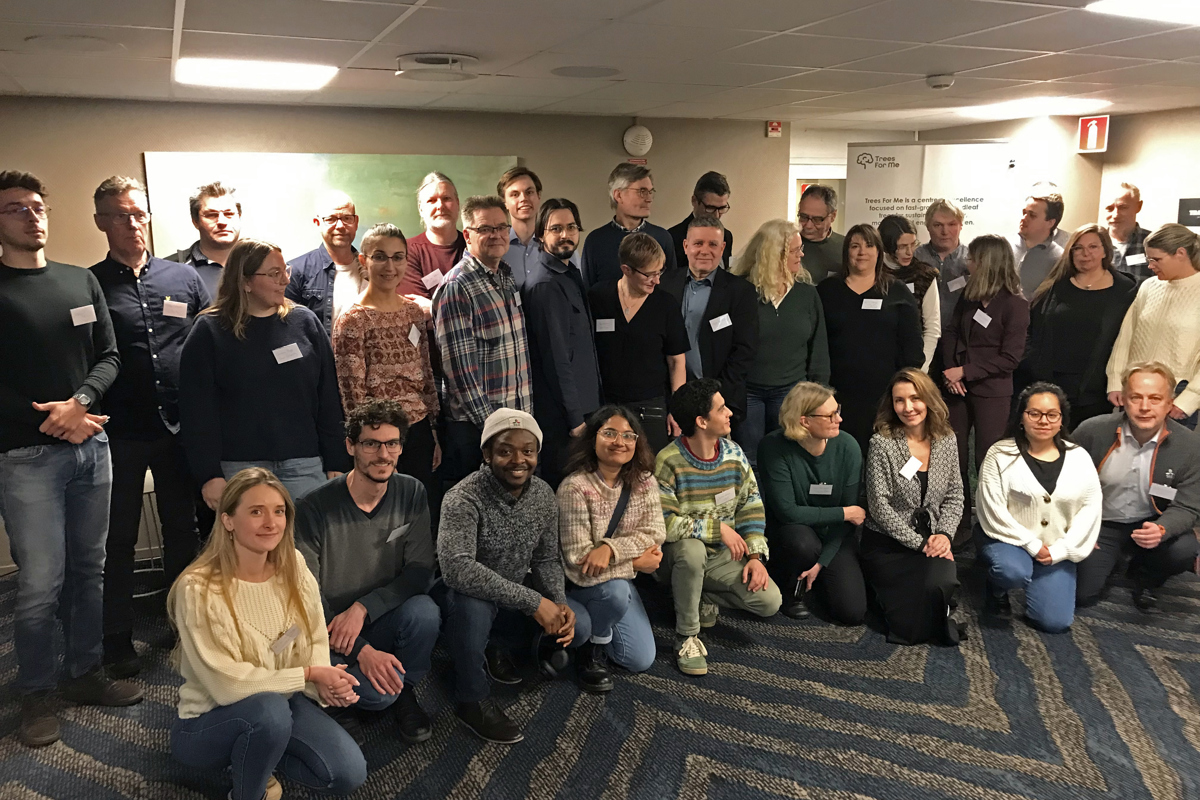 Group image of people in conference room. Photo.